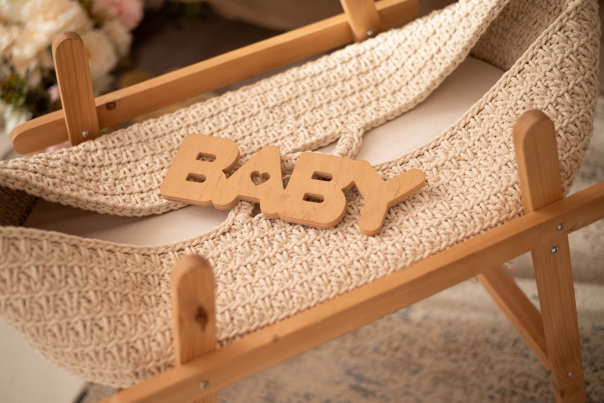 Baby's cradle is ready for a newborn.