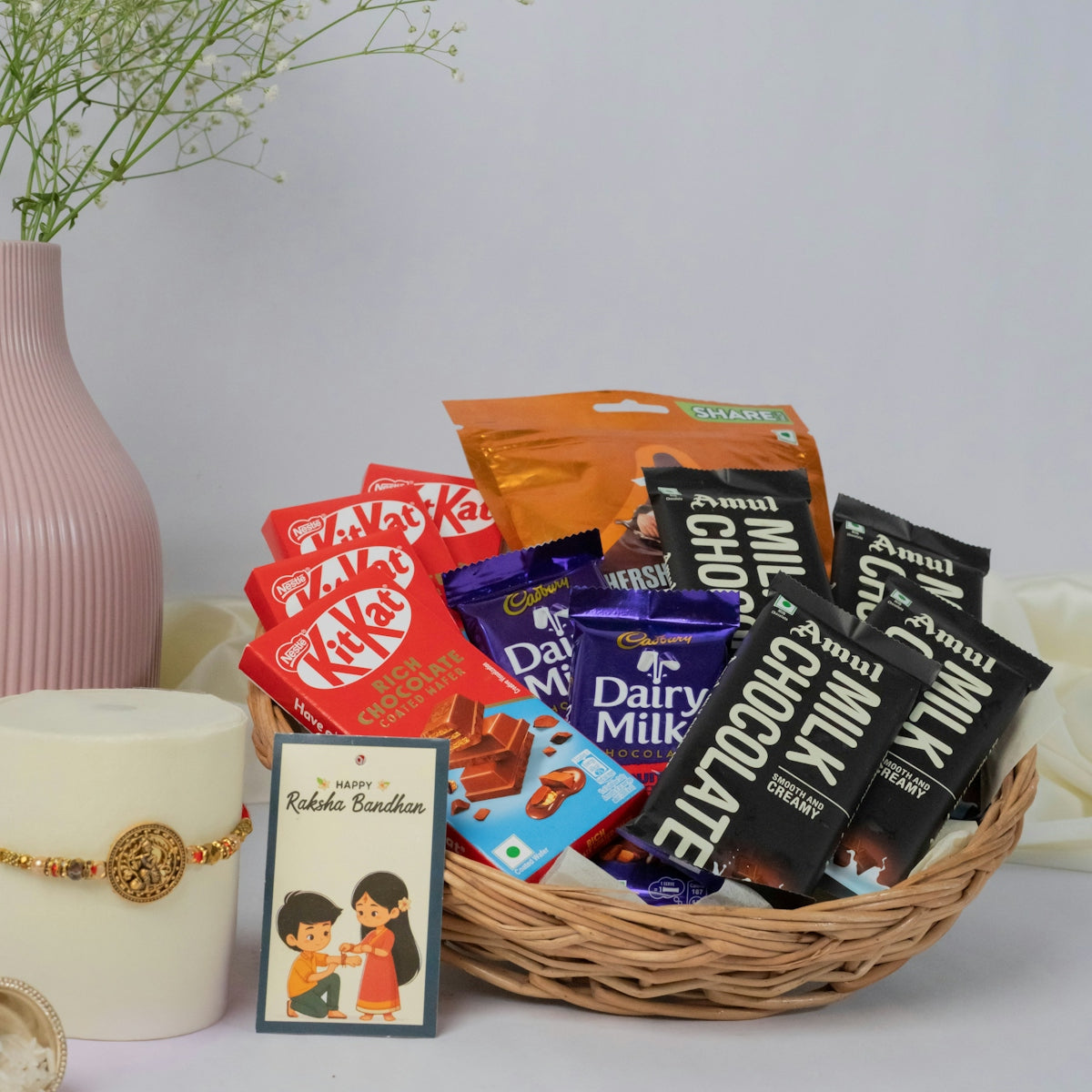 A chocolate gift basket, card, and candle.